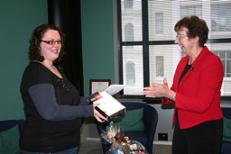 Mills & Boon winner receives prize from Jane Hill, Libraries Manager