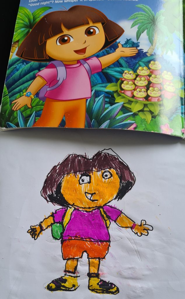 A hand-drawn and vibrantly-coloured Dora the Explorer sits beneath the original art from the book.
