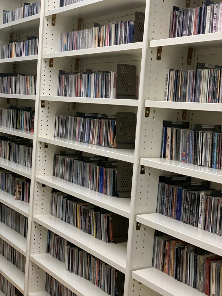 Large shelves at our storage facility, packed to the brim with CDs available for reserve