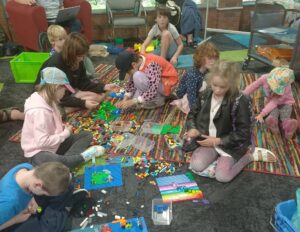 A group of children building LEGO®