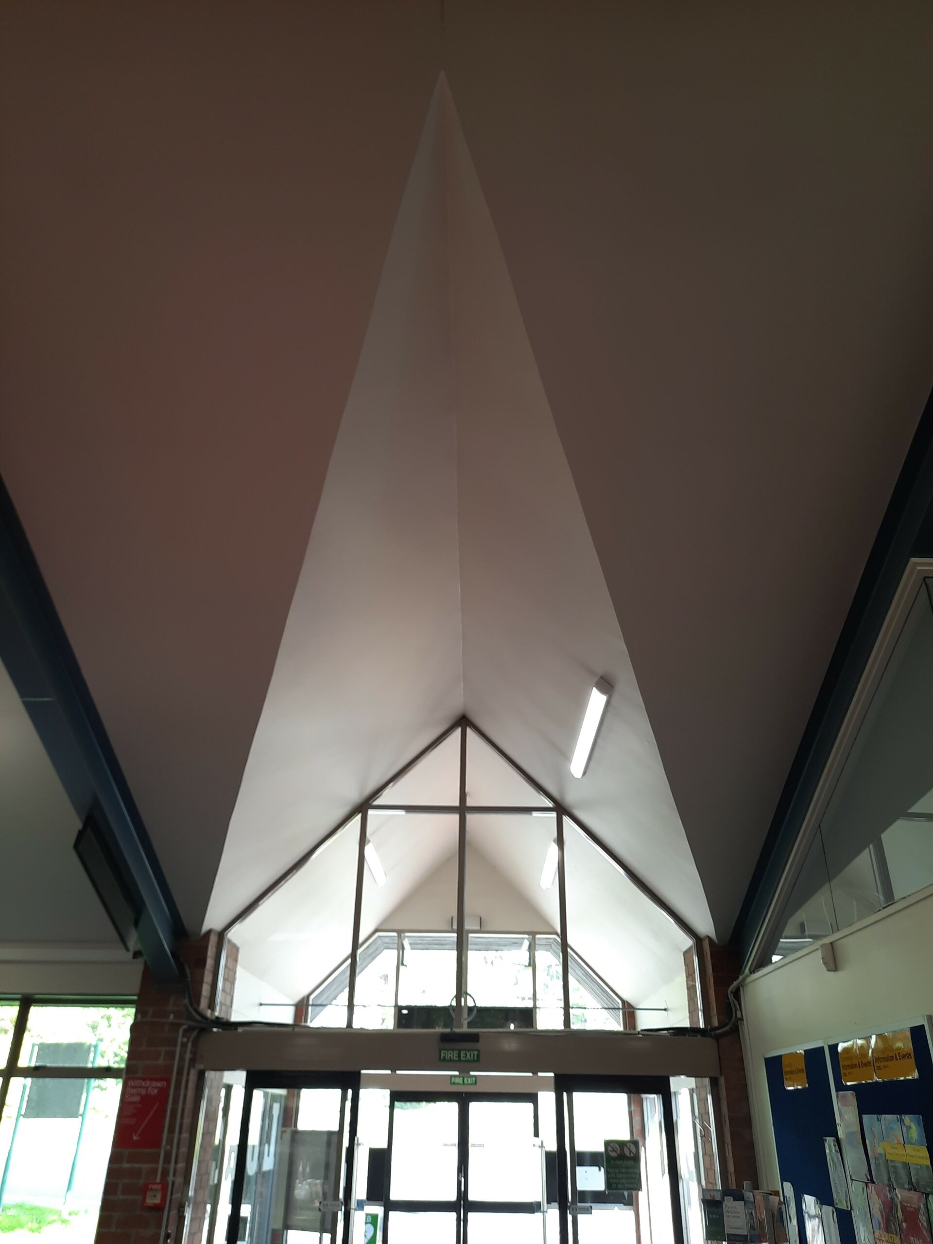 Towards the library entry/exit, and internal five-sided window sits in the pointed ceiling.